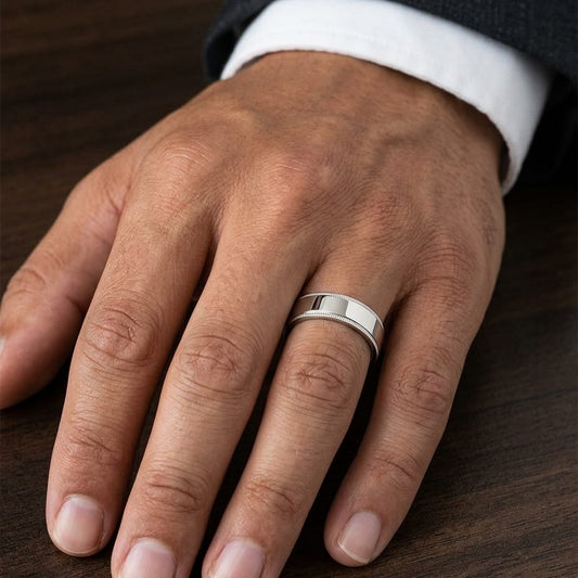 6mm Flat Milgrain Comfort-Fit Wedding Band in 18K Yellow Gold, worn on hand, masculine close-up