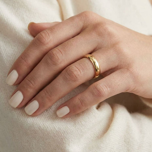 4mm High Dome Comfort-Fit Wedding Band in 18K Yellow Gold, worn on hand, close-up