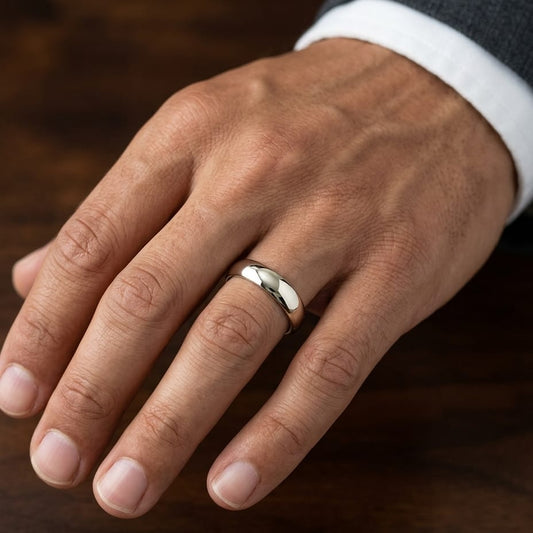 5mm High Dome Comfort-Fit Wedding Band in 18K Yellow Gold, worn on hand, masculine close-up