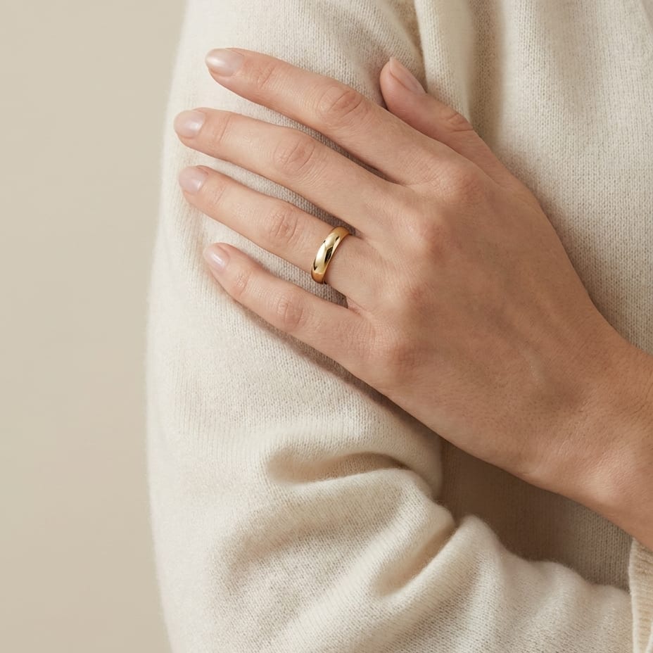 4mm Slightly Domed Comfort-Fit Wedding Band in 18K Yellow Gold, worn on hand, full view