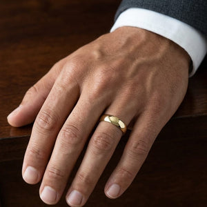 8mm Slightly Domed Comfort-Fit Wedding Band in 18K Yellow Gold, worn on hand, masculine close-up