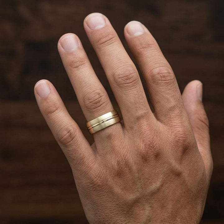 6mm Satin Finish High Polished Center Cut Carved Wedding Band in 18K Yellow Gold, worn on hand, masculine close-up