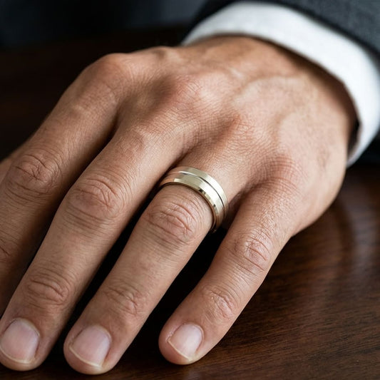 6mm Satin Finish Carved Wedding Band in 18K Yellow Gold, worn on hand, masculine close-up
