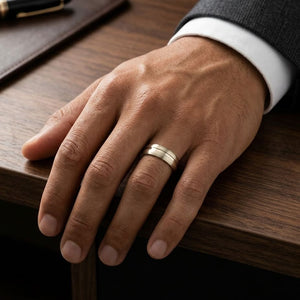 7.5mm Satin Finish High Polished Center Cut Carved Wedding Band in 18K Yellow Gold, worn on hand, masculine full view