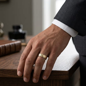 6mm Hammered Center High Polish Round Edge Carved Wedding Band in 18K Yellow Gold, worn on hand, masculine full view