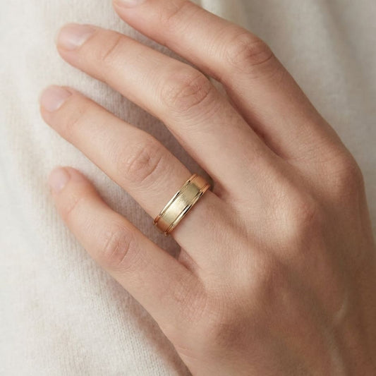 4mm Satin Finish High Polished Round Edge Carved Wedding Band in 18K Yellow Gold, worn on hand, close-up