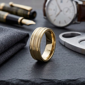 8mm Satin Finish High Polished Center Trim Carved Wedding Band in 18K Yellow Gold, on walnut surface with pocket square