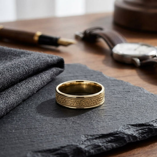 6mm Celtic Knot Carved Wedding Band in 18K Yellow Gold, on walnut surface with pocket square