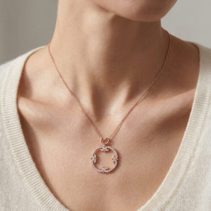 Natural Diamond Round Brilliant Pendant in 14K Rose Gold, worn close-up portrait