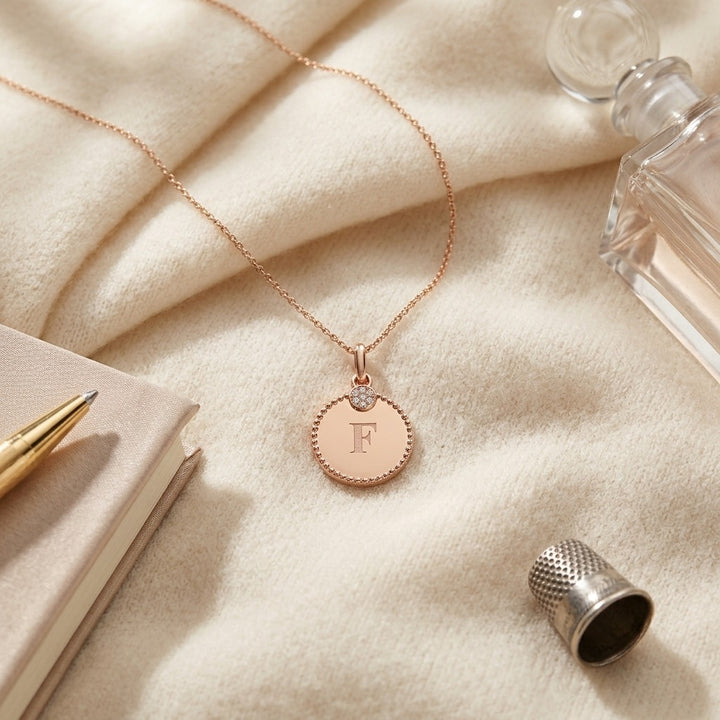 14K Gold Diamond Accent Initial Disc Pendant in 14K Rose Gold - flat lay