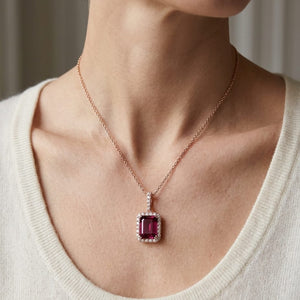 Pink Tourmaline Halo Pendant in 14K Rose Gold, worn close-up portrait