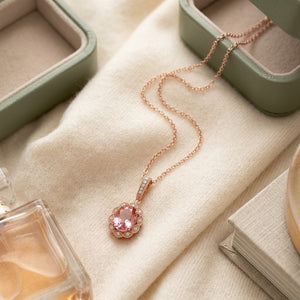 Oval Pink Tourmaline & Diamond Halo Pendant in 14K Rose Gold - flat lay