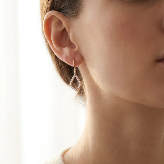 Diamond Drop Earrings in 14K Rose Gold, worn close-up portrait