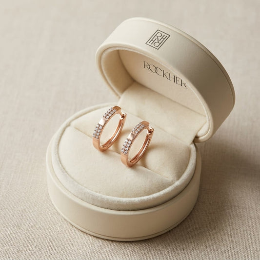 Diamond Pave Linear Oval Hoop Earrings With High Polish Accent in 14K Rose Gold, in navy velvet jewelry box