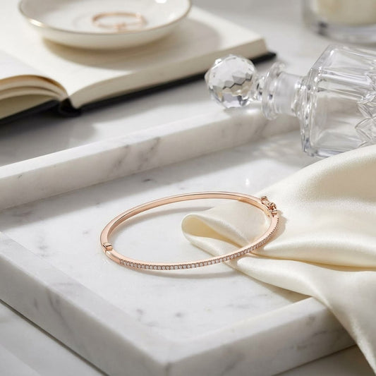 Pave Bangle in 14K Rose Gold, on marble vanity tray with silk