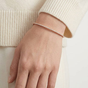 Pave Bangle in 14K Rose Gold, worn close-up portrait