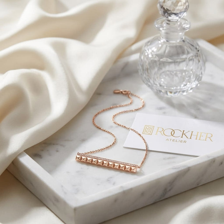 Pave Diamond And Spikes Bar Necklace in 14K Rose Gold, on marble vanity tray with silk