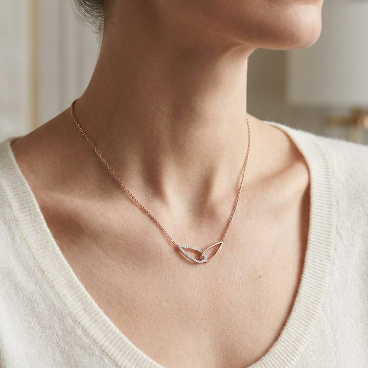 Diamond Pave And High Polish Teardrop Interlink Necklace in 14K Rose Gold, 16-18 Inch, worn close-up portrait