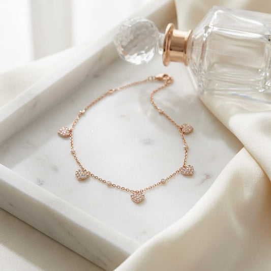 Diamond Pave Dangling 5-heart Station Necklace in 14K Rose Gold, 16-18 Adj Chn, on marble vanity tray with silk