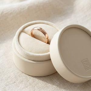4mm Slightly Domed Traditional Oval Wedding Band in 14K Rose Gold, in navy velvet jewelry box