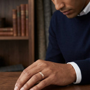 5mm Slightly Domed Traditional Oval Milgrain Wedding Band in 14K Rose Gold, worn on hand, masculine full view
