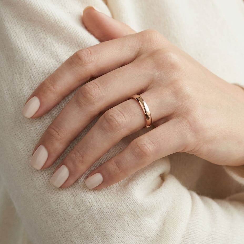 3.5mm Flat Comfort-Fit Wedding Band in 14K Rose Gold, worn on hand, close-up