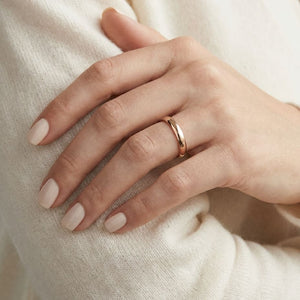 3.5mm Flat Comfort-Fit Wedding Band in 14K Rose Gold, worn on hand, close-up