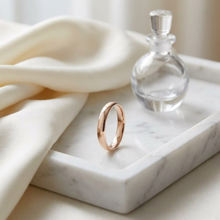 3.5mm Flat Comfort-Fit Wedding Band in 14K Rose Gold, on marble vanity tray with silk