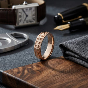 6mm Comfort-Fit Wedding Band in 14K Rose Gold, on walnut surface with pocket square