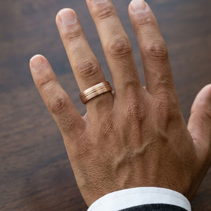 6mm Satin Finish High Polished Center Cut Carved Wedding Band in 14K Rose Gold, worn on hand, masculine close-up
