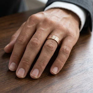 6mm Satin Finish Parallel Center Cut Carved Wedding Band in 14K Rose Gold, worn on hand, masculine close-up