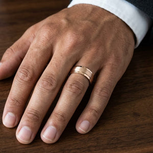 7mm Satin Finish High Polished Beveled Edge Carved Wedding Band in 14K Rose Gold, worn on hand, masculine close-up