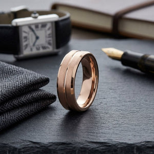 6mm Satin Finish Carved Wedding Band in 14K Rose Gold, on walnut surface with pocket square