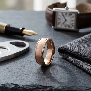 8mm Wire Brush High Polished Round Edge Carved Wedding Band in 14K Rose Gold, on walnut surface with pocket square