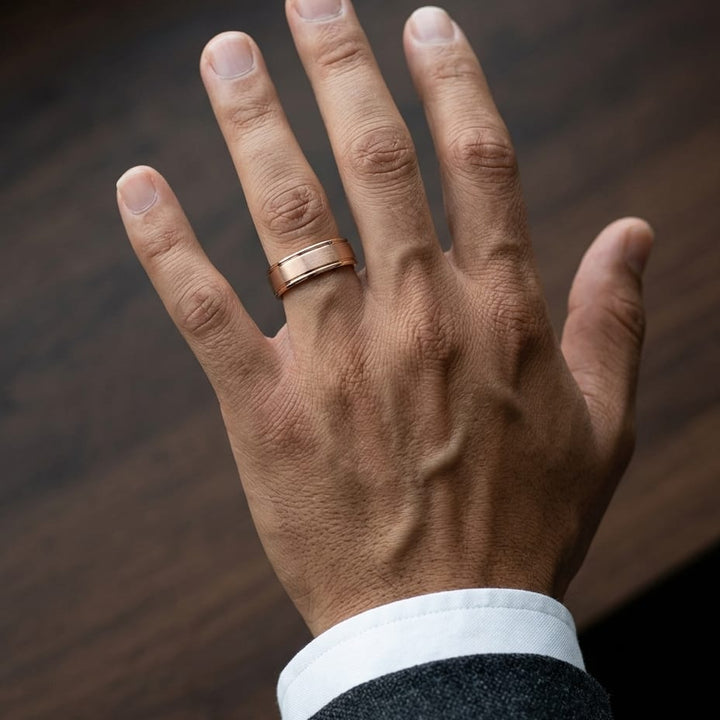 7mm Satin Finish High Polished Round Edge Carved Wedding Band in 14K Rose Gold, worn on hand, masculine close-up