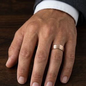 6mm Satin Finish High Polished Center Trim Carved Wedding Band in 14K Rose Gold, worn on hand, masculine close-up