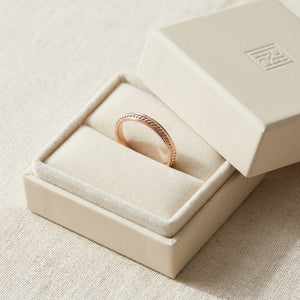 2mm High Polish Carved Wedding Band in 14K Rose Gold, in navy velvet jewelry box