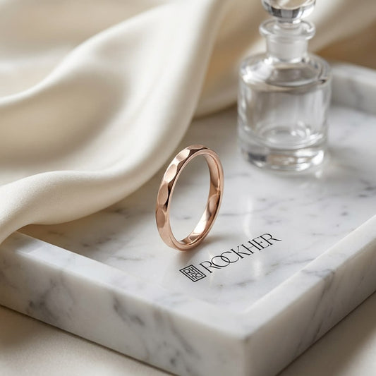 2mm High Polish Carved Wedding Band in 14K Rose Gold, on marble vanity tray with silk