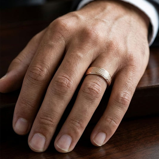7.5mm Round Edge Mesh Center Carved Wedding Band in 14K Rose Gold, worn on hand, masculine close-up