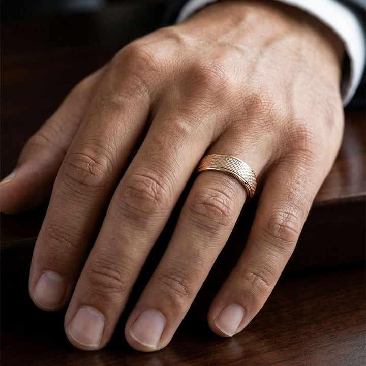 7.5mm Round Edge Mesh Center Carved Wedding Band in 14K Rose Gold, worn on hand, masculine close-up