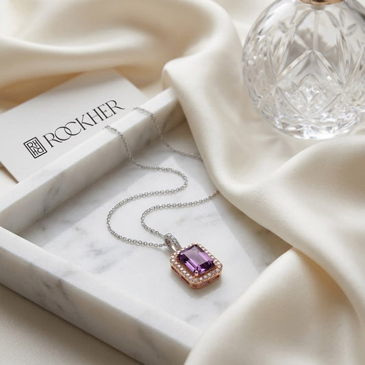 Amethyst And Diamond Emerald-cut Halo Pendant In 14k Two Tone Gold (8x6mm Center), on marble vanity tray with silk