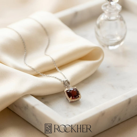 Garnet and Diamond Pendant in 14K Two-Tone Gold, 3.70ct, on marble vanity tray with silk