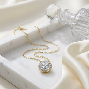 Round Diamond Halo Cluster Pendant In 14k Two Tone Gold Adj 16-18 Inch Chain(5/8 Ct.tw.), on marble vanity tray with silk