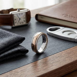 6mm High Polish Carved Wedding Band in 14K Two-Tone Gold, on walnut surface with pocket square