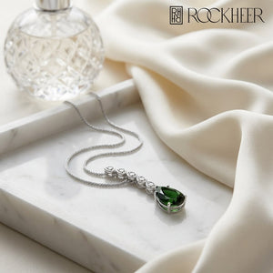 Green Tourmaline Pendant in 14K White Gold, on marble vanity tray with silk
