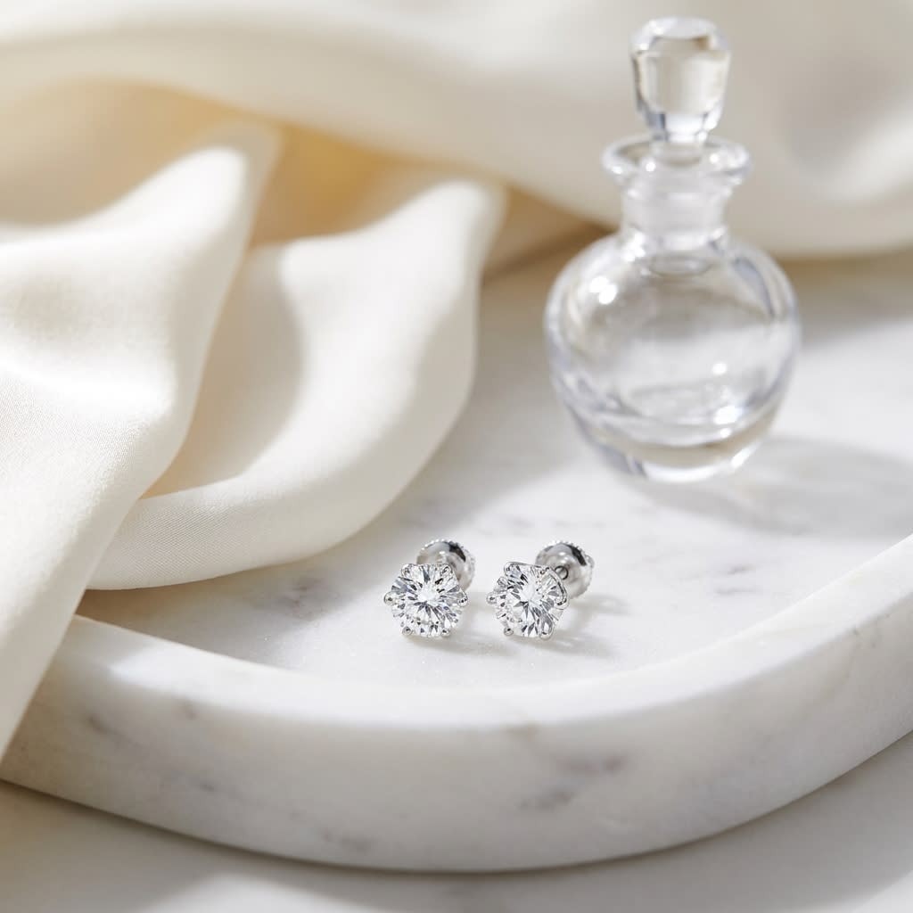 Natural Diamond Round Brilliant Six Prong Stud Earrings in 14K White Gold, on marble vanity tray with silk