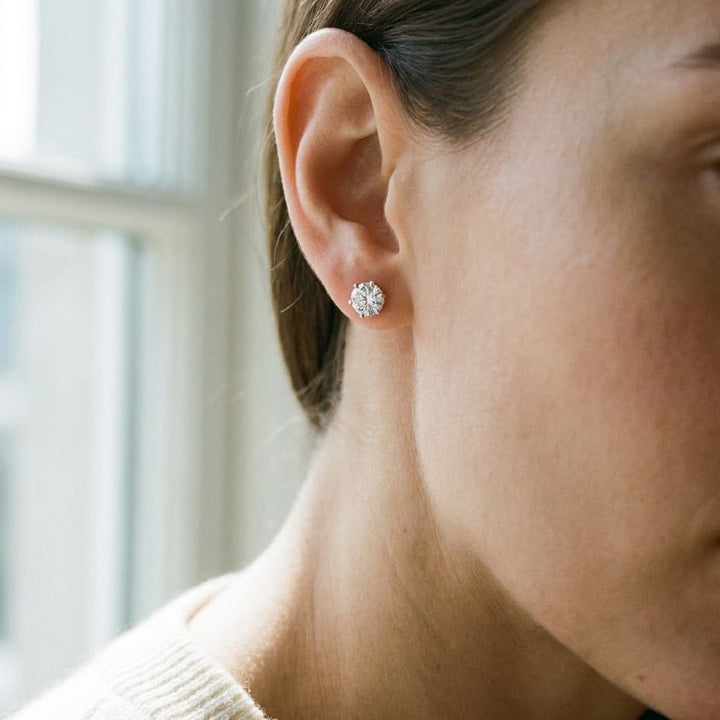 Natural Diamond Round Brilliant Six Prong Stud Earrings in 14K White Gold, worn close-up portrait