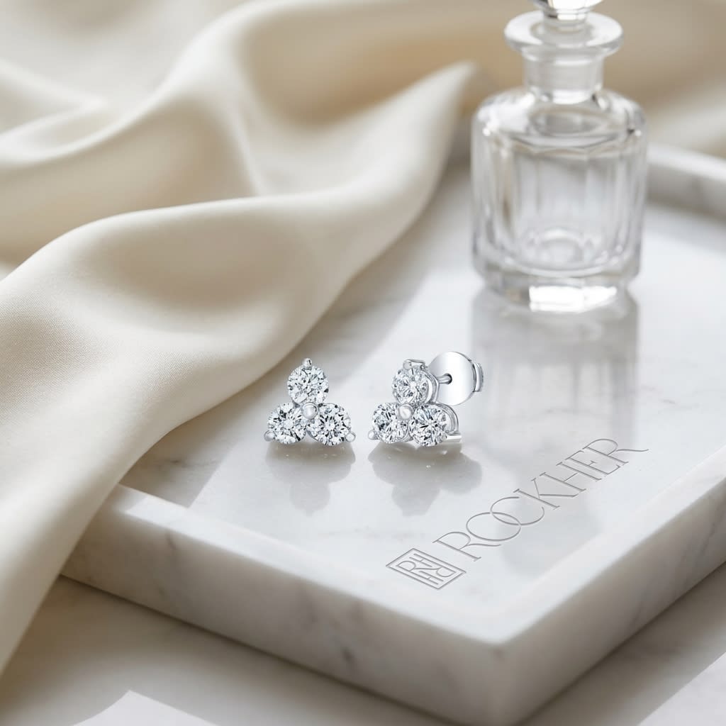 Diamond Flower Earring in 14K White Gold, on marble vanity tray with silk