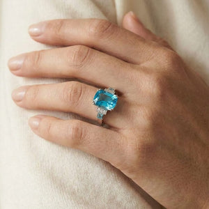 Swiss Blue Topaz and Diamond Step Ring 0.03ctw, worn on hand, close-up