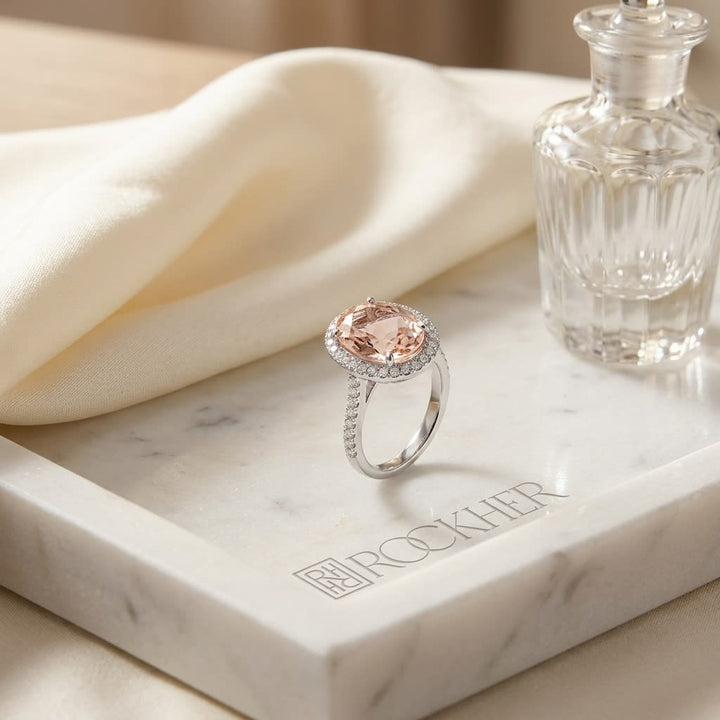Oval Morganite and Diamond Halo Ring in 14K White Gold, 1.10ct, on marble vanity tray with silk